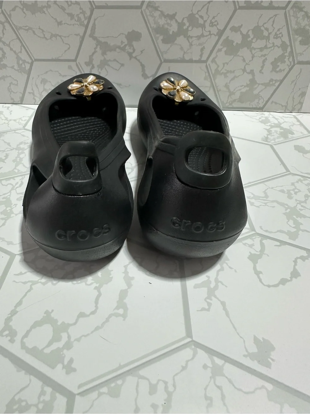 CROCS Black Women's Slip-On Flats with Gold Floral Charms